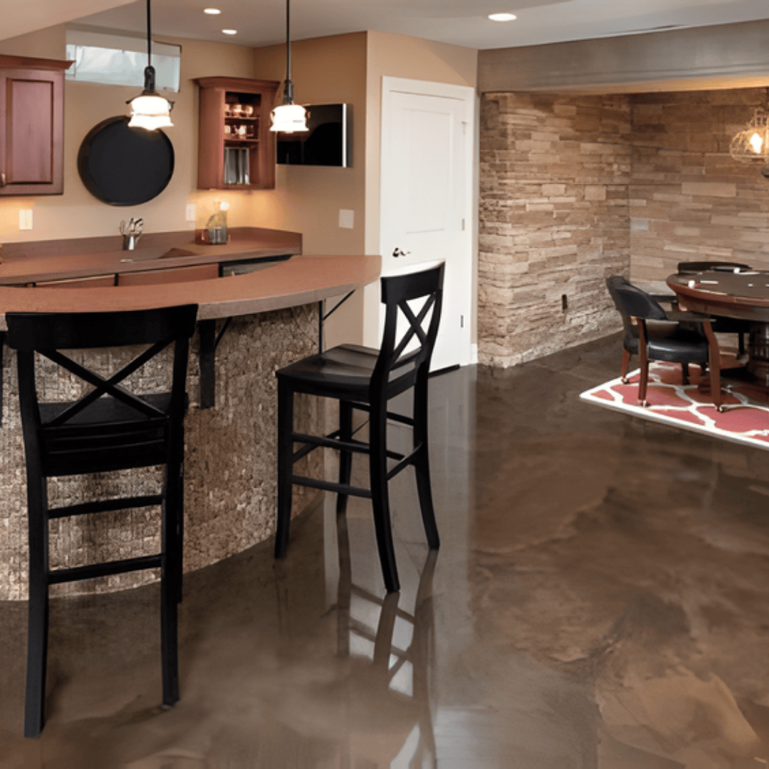 Basement with bar and dining area; brown countertop and stone accent wall, black bar stools, glossy flooring.